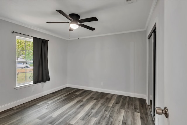 empty room with crown molding, ceiling fan, and wood-type flooring