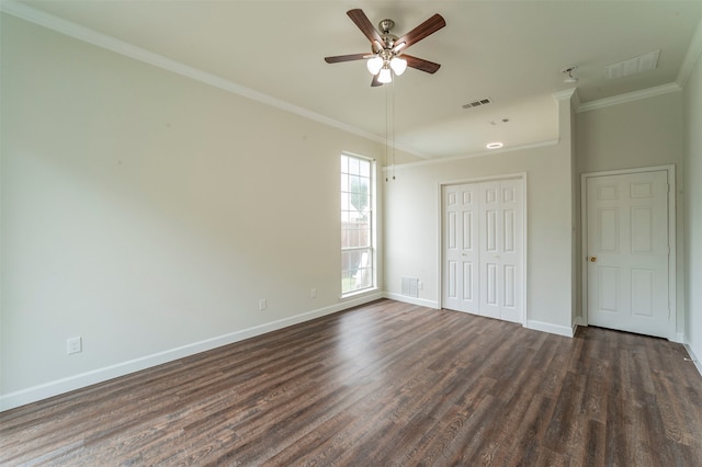 spare room featuring ceiling fan, ornamental molding, and dark hardwood / wood-style flooring