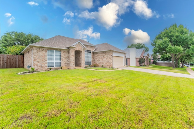 view of front of house featuring a garage and a front yard