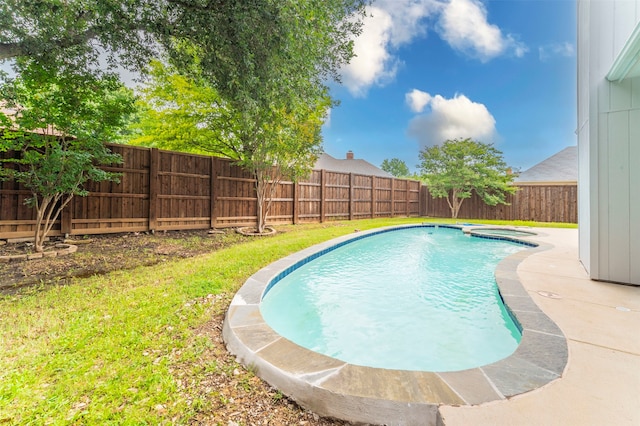 view of swimming pool featuring a yard and a patio