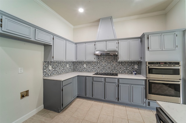 kitchen featuring light tile patterned floors, decorative backsplash, black electric cooktop, and stainless steel double oven