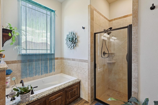 bathroom with hardwood / wood-style floors and shower with separate bathtub