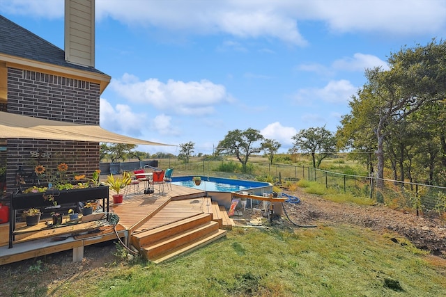 view of yard with a swimming pool side deck