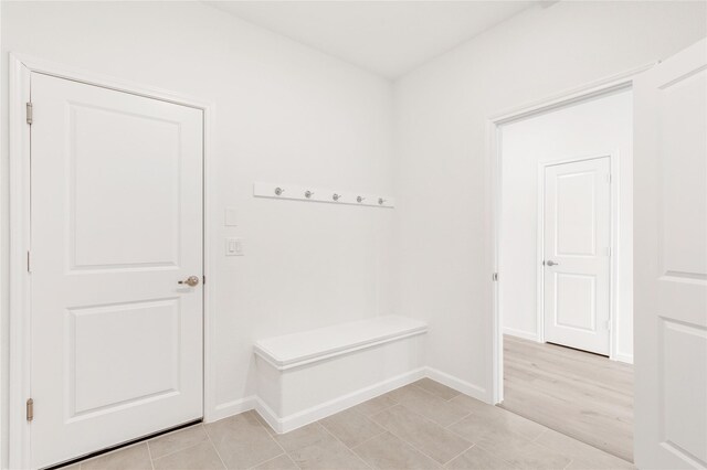 laundry area featuring gas dryer hookup, electric dryer hookup, hookup for a washing machine, and light tile patterned floors