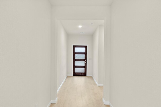 bedroom with lofted ceiling and light colored carpet