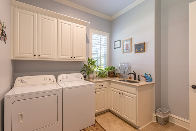 clothes washing area featuring crown molding, independent washer and dryer, sink, light tile patterned flooring, and cabinets