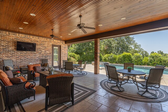 view of patio / terrace featuring ceiling fan