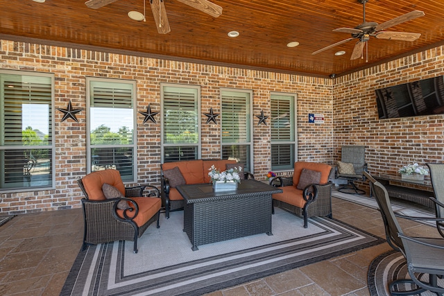 view of patio / terrace with an outdoor living space and ceiling fan