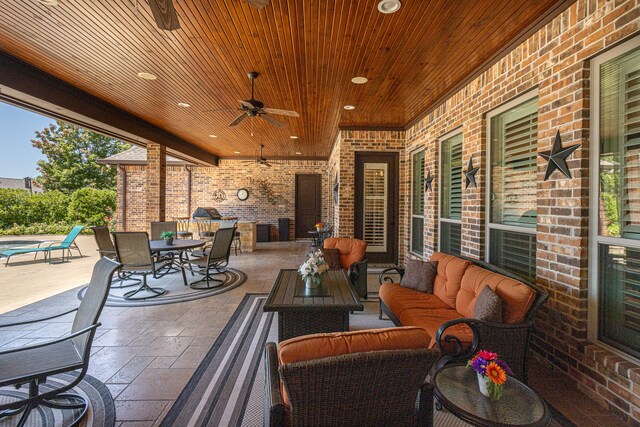 view of patio with ceiling fan and an outdoor hangout area