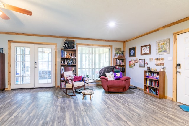 sitting room with a wealth of natural light, hardwood / wood-style floors, and ceiling fan