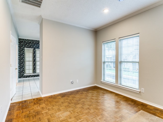 spare room featuring crown molding, a textured ceiling, and light parquet flooring