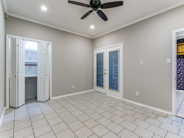 unfurnished room featuring french doors, ceiling fan, ornamental molding, and a textured ceiling