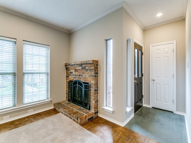 unfurnished living room featuring parquet flooring, ornamental molding, a brick fireplace, and a textured ceiling