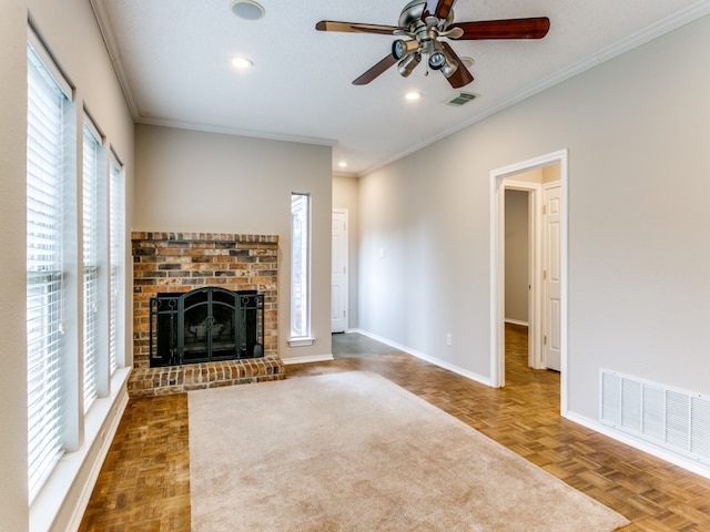 unfurnished living room featuring a fireplace, crown molding, parquet flooring, and ceiling fan