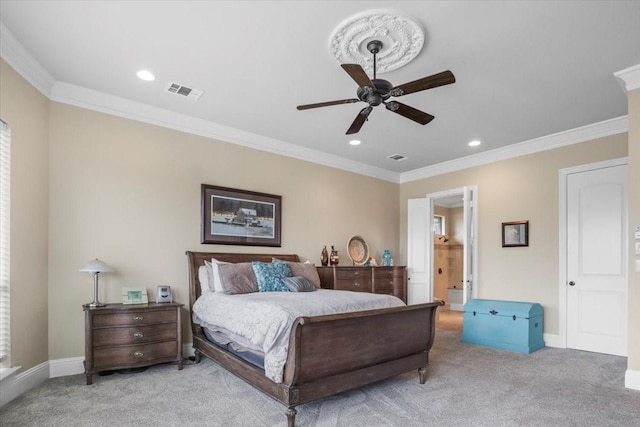 carpeted bedroom featuring ceiling fan and ornamental molding