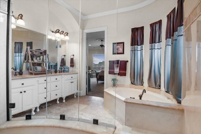 bathroom with ceiling fan, crown molding, vanity, and a relaxing tiled tub