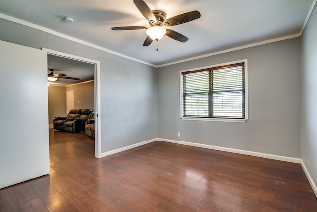 empty room with ceiling fan, dark hardwood / wood-style floors, and crown molding