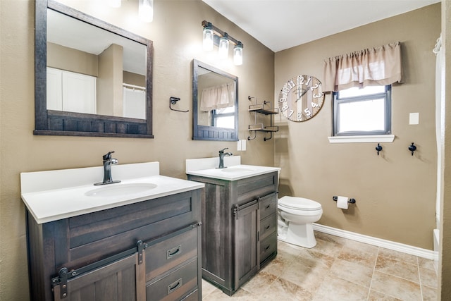 bathroom with toilet and vanity