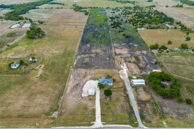 birds eye view of property with a rural view