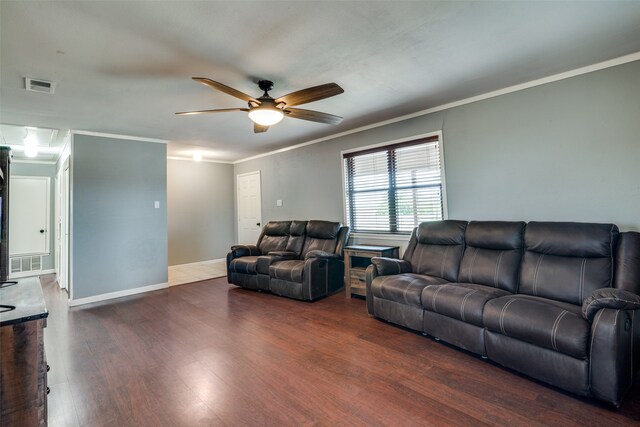 living room with ornamental molding, ceiling fan, and dark hardwood / wood-style floors