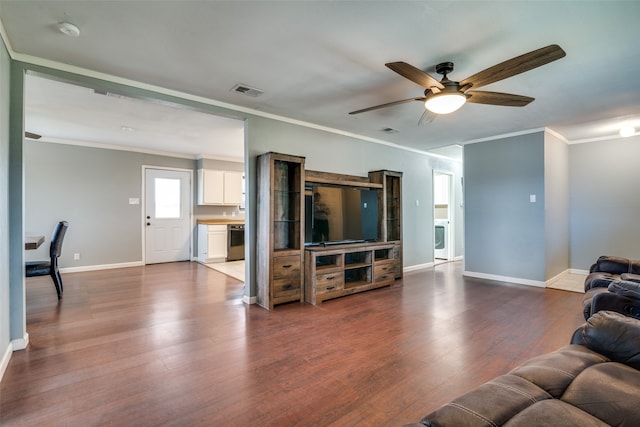 living room featuring washer / clothes dryer, ceiling fan, ornamental molding, and hardwood / wood-style flooring