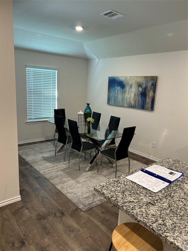 dining room with dark wood-type flooring