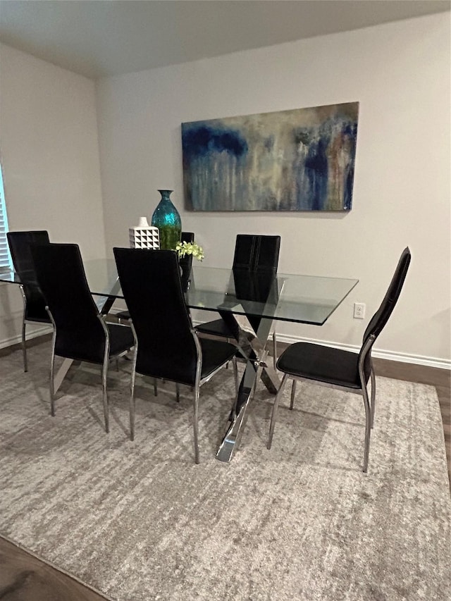 dining room with hardwood / wood-style flooring