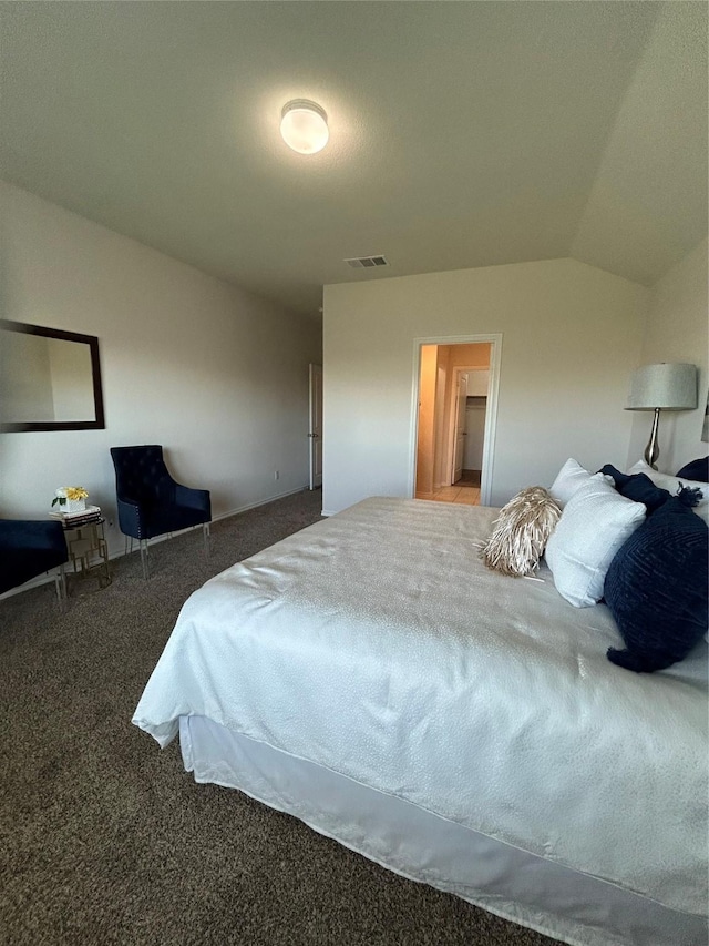 carpeted bedroom featuring vaulted ceiling