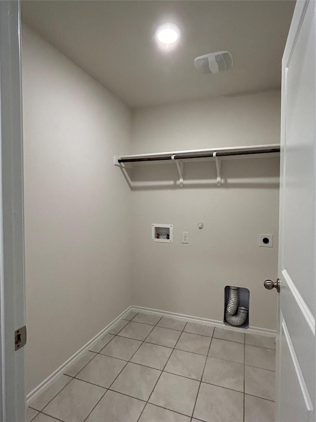 washroom featuring hookup for a washing machine, gas dryer hookup, electric dryer hookup, and light tile patterned flooring