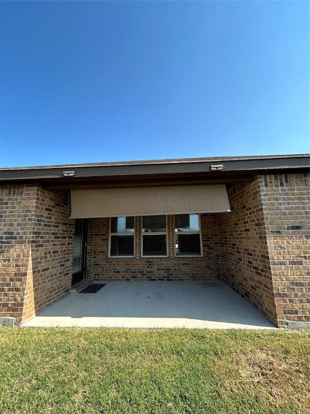 back of property with a patio area