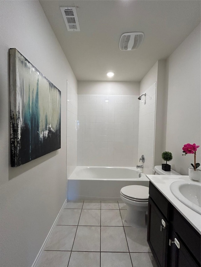 full bathroom with tile patterned flooring, vanity, toilet, and tiled shower / bath