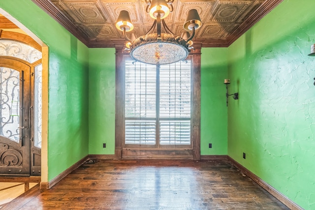 interior space featuring plenty of natural light, an inviting chandelier, and dark wood-type flooring