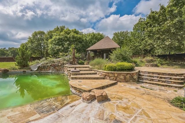 exterior space featuring a patio and a pool