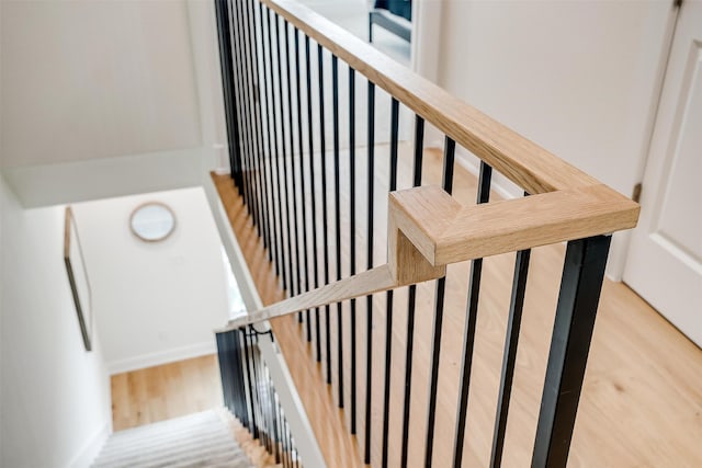 stairway featuring wood-type flooring