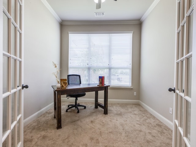 carpeted home office featuring ornamental molding and french doors