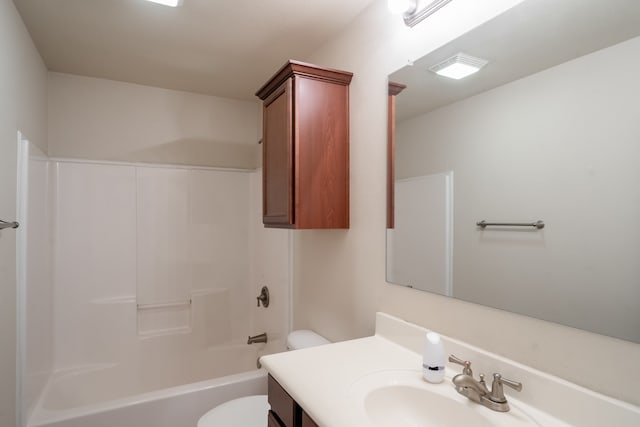 full bathroom featuring toilet, vanity, and  shower combination