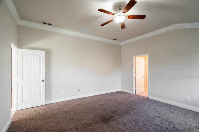 spare room with carpet flooring, ornamental molding, and ceiling fan