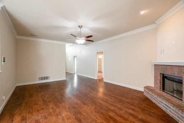 unfurnished living room featuring ornamental molding, a fireplace, and dark hardwood / wood-style flooring