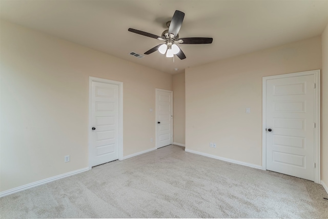 unfurnished bedroom with light carpet and ceiling fan