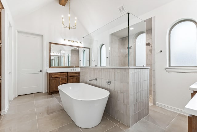 bathroom featuring lofted ceiling, separate shower and tub, tile patterned floors, and vanity