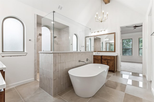 bathroom featuring a freestanding tub, visible vents, vanity, tile patterned floors, and walk in shower