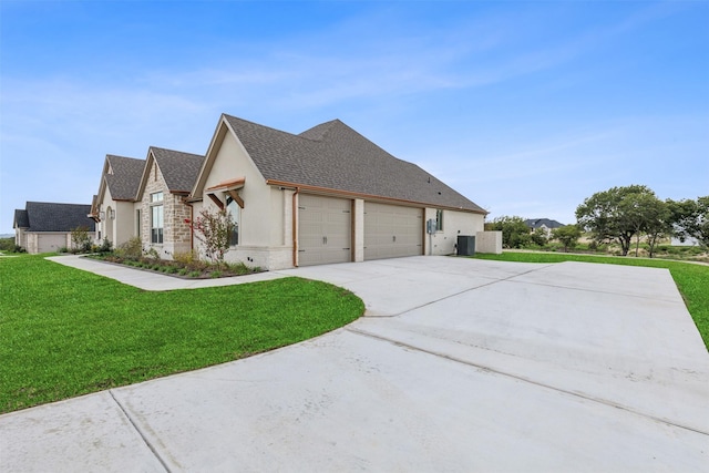 view of home's exterior with central AC unit, a garage, a shingled roof, a yard, and driveway