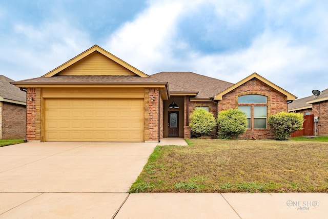 ranch-style house with a garage and a front lawn