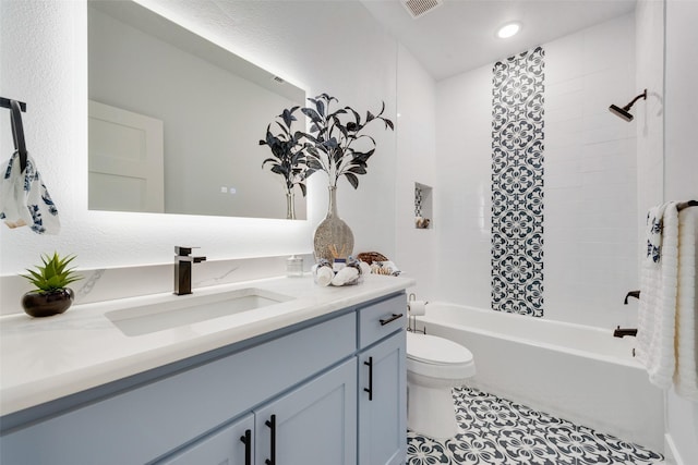 full bath featuring vanity, recessed lighting, shower / bathing tub combination, toilet, and tile patterned floors