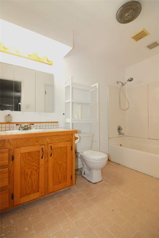 full bathroom featuring shower / bathing tub combination, vanity, and toilet