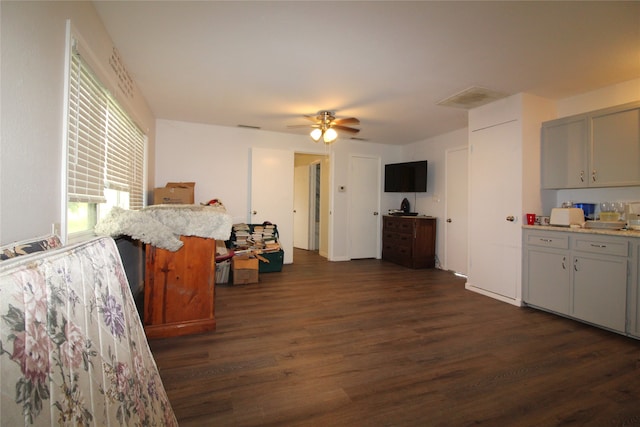 kitchen featuring dark wood-type flooring and ceiling fan