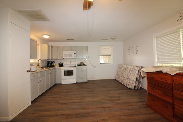 kitchen featuring white appliances, dark hardwood / wood-style floors, tasteful backsplash, and ceiling fan