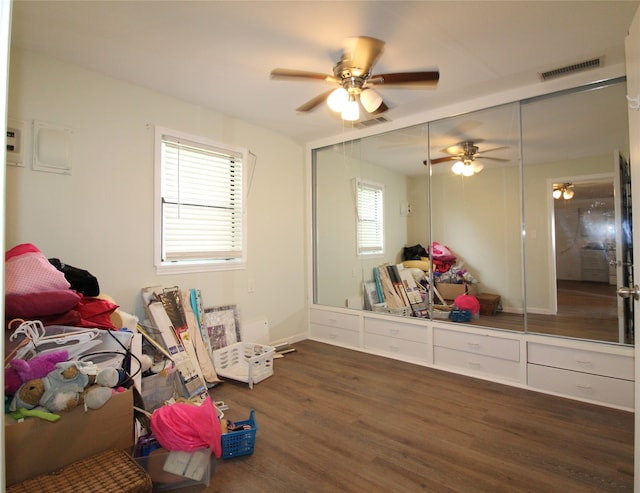 bedroom featuring dark wood-type flooring and ceiling fan