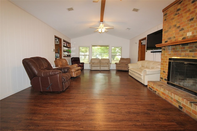 living room featuring ceiling fan, a fireplace, dark hardwood / wood-style flooring, and lofted ceiling with beams