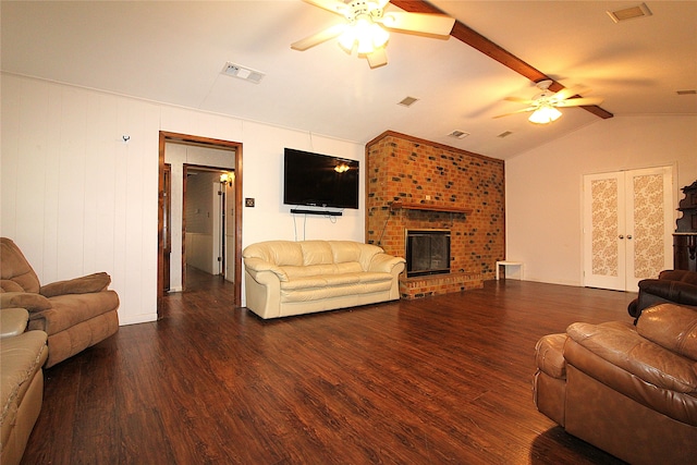 living room with a fireplace, lofted ceiling, ceiling fan, and dark hardwood / wood-style floors